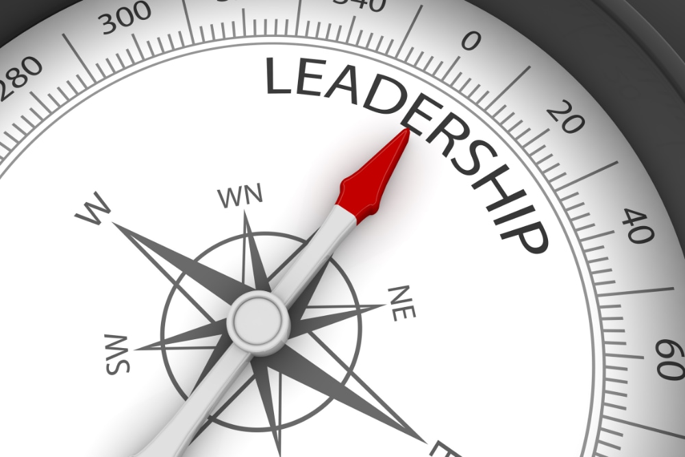 Compass face with a needle pointing towards the word 'Leadership,' symbolizing Unlocking Hidden Leadership Strengths